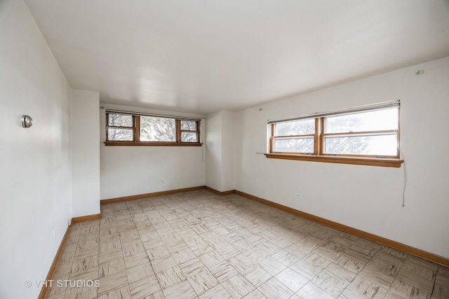 3101 S 53rd Ct, Cicero, IL 60804 - empty room featuring baseboards and a healthy amount of sunlight