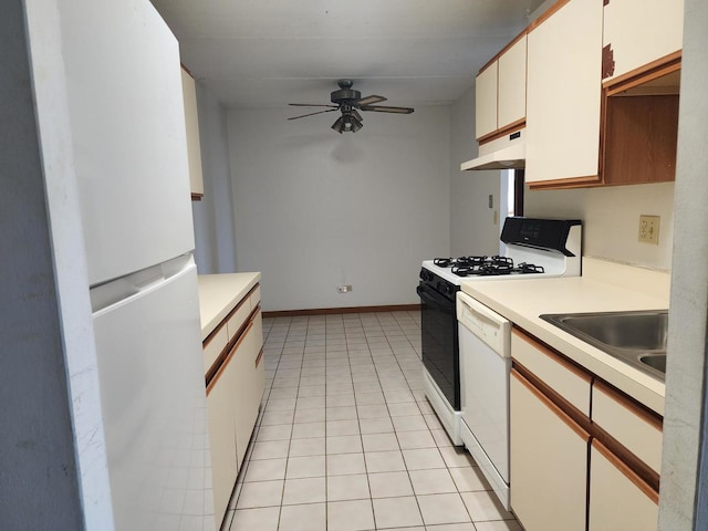 5011 S Valley Ln Unit 409, Streamwood, IL 60107 - kitchen with white appliances, under cabinet range hood, light countertops, ceiling fan, and light tile patterned floors