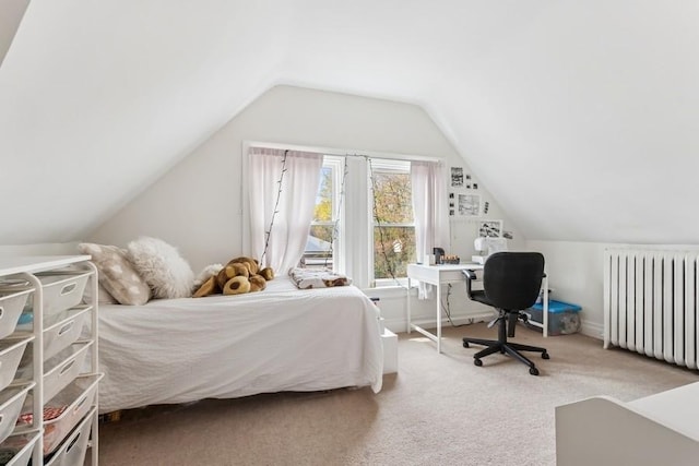 carpeted bedroom with vaulted ceiling and radiator heating unit