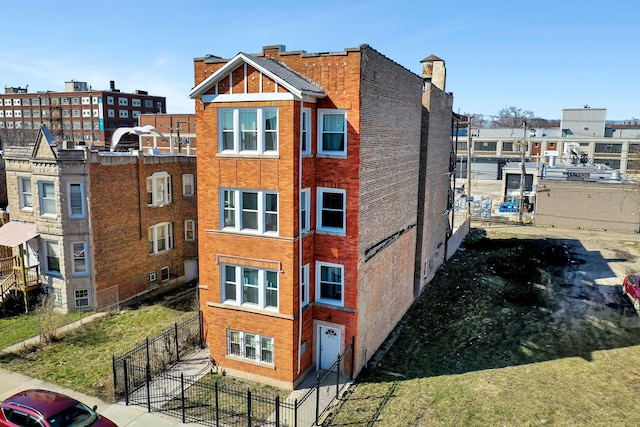 view of building exterior featuring fence