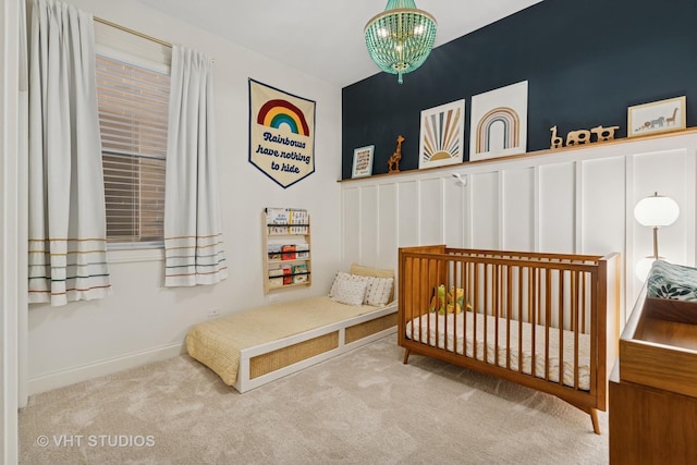 4845 N Damen Ave Unit 3S, Chicago, IL 60625 - bedroom with a notable chandelier and carpet floors