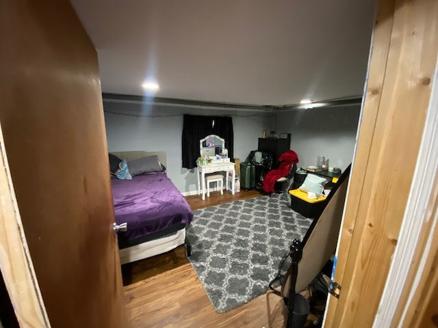 bedroom with wood finished floors