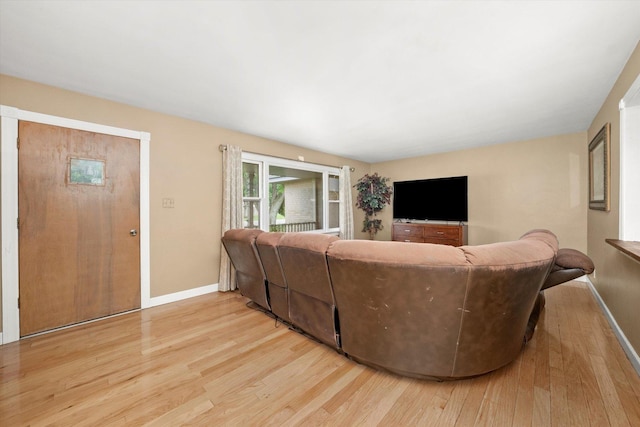910 Sarah Ln, Aurora, IL 60502 - living room with light wood finished floors and baseboards