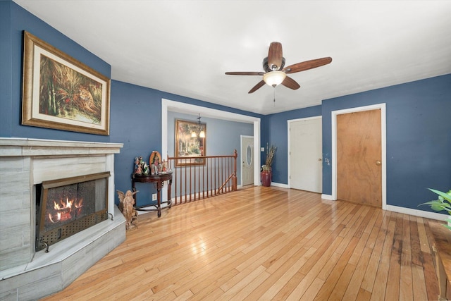 910 Sarah Ln, Aurora, IL 60502 - unfurnished living room with hardwood / wood-style floors, ceiling fan, and baseboards