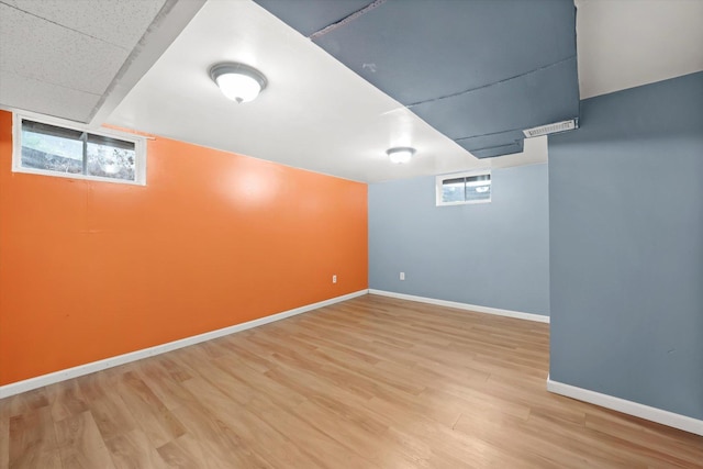 910 Sarah Ln, Aurora, IL 60502 - basement featuring plenty of natural light, baseboards, and light wood-style floors