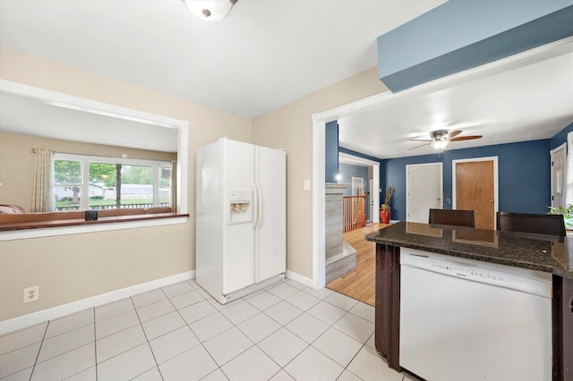 910 Sarah Ln, Aurora, IL 60502 - kitchen featuring white appliances, ceiling fan, light tile patterned floors, dark stone countertops, and baseboards