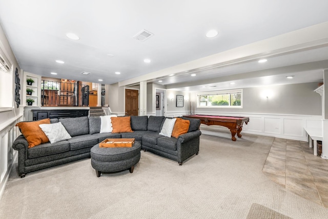 living area featuring light carpet, a decorative wall, billiards, indoor bar, and visible vents