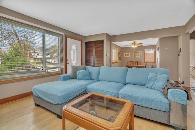 17531 Burnham Ave, Lansing, IL 60438 - living room featuring light wood finished floors, a ceiling fan, and baseboards