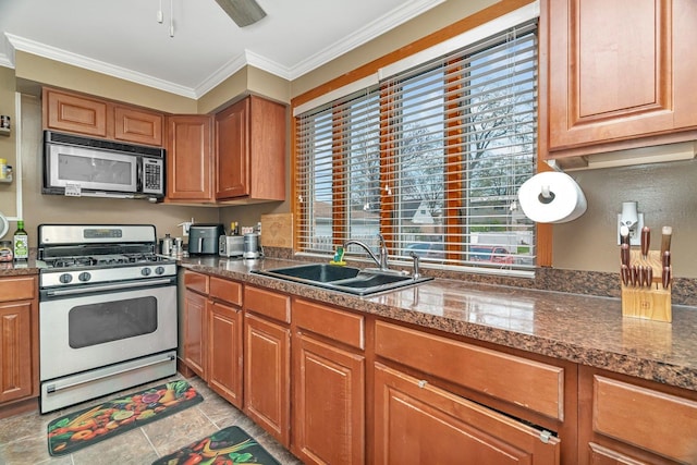 17531 Burnham Ave, Lansing, IL 60438 - kitchen featuring brown cabinetry, a sink, appliances with stainless steel finishes, and crown molding