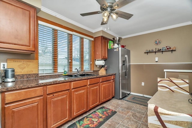 17531 Burnham Ave, Lansing, IL 60438 - kitchen with brown cabinetry, crown molding, a sink, and stainless steel fridge