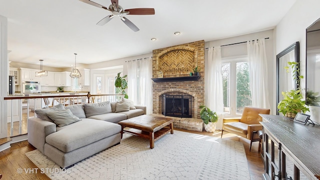 1531 Walnut St, Western Springs, IL 60558 - living area with hardwood / wood-style flooring, a ceiling fan, a brick fireplace, and recessed lighting