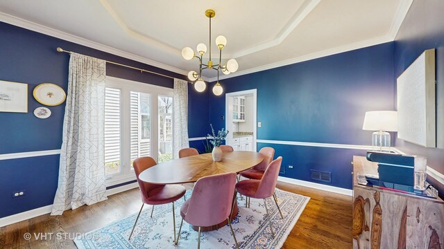 1531 Walnut St, Western Springs, IL 60558 - dining area with plenty of natural light, a tray ceiling, wood finished floors, and crown molding