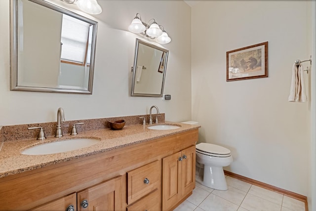 1496 Trailwood Dr, Crystal Lake, IL 60014 - full bathroom with toilet, tile patterned floors, double vanity, and baseboards