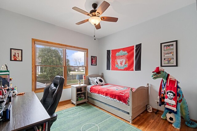 1496 Trailwood Dr, Crystal Lake, IL 60014 - bedroom featuring wood finished floors, a desk, baseboards, and a ceiling fan