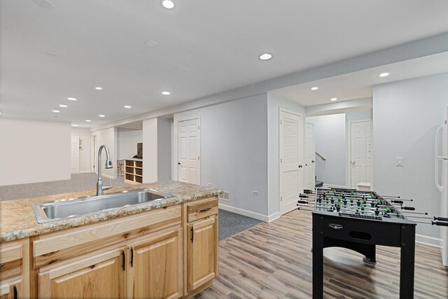 1496 Trailwood Dr, Crystal Lake, IL 60014 - kitchen with a sink, recessed lighting, light brown cabinetry, light wood-type flooring, and baseboards