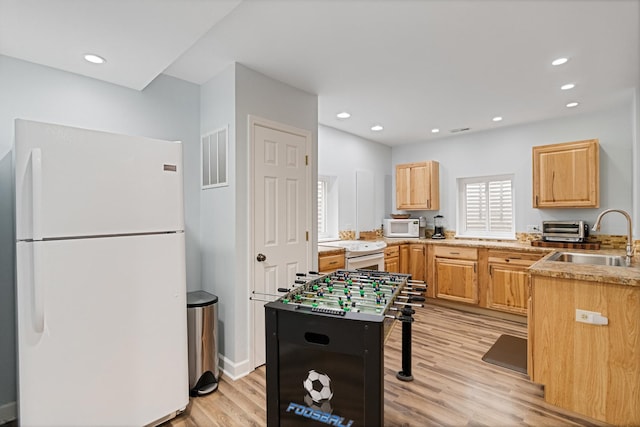 1496 Trailwood Dr, Crystal Lake, IL 60014 - kitchen with white appliances, a sink, light wood finished floors, light brown cabinetry, and recessed lighting
