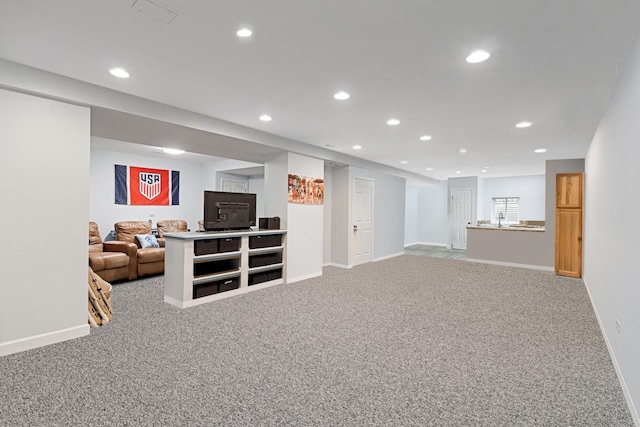 1496 Trailwood Dr, Crystal Lake, IL 60014 - finished basement with recessed lighting, carpet, baseboards, and a sink