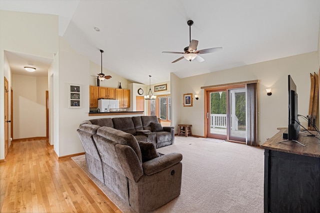 1496 Trailwood Dr, Crystal Lake, IL 60014 - living room featuring a ceiling fan, lofted ceiling, baseboards, a chandelier, and light wood finished floors