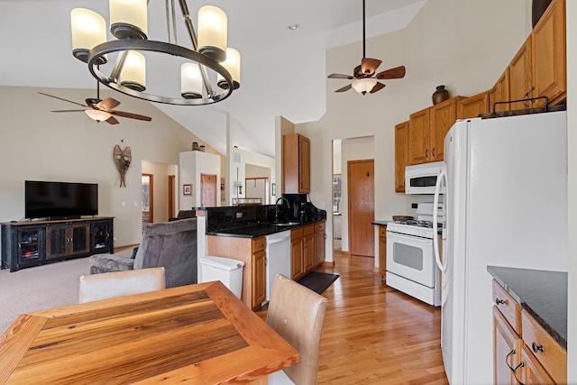 1496 Trailwood Dr, Crystal Lake, IL 60014 - kitchen featuring a ceiling fan, white appliances, a sink, a chandelier, and light wood-type flooring