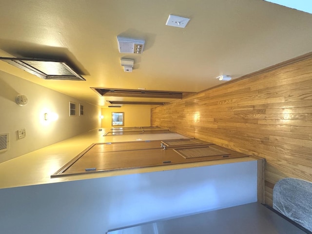 4242 S Vincennes Ave Unit 2, Chicago, IL 60653 - corridor with wooden walls and finished concrete flooring