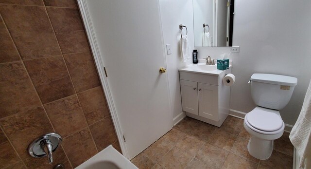 4627 W Schubert Ave, Chicago, IL 60639 - full bathroom with baseboards, toilet, and vanity