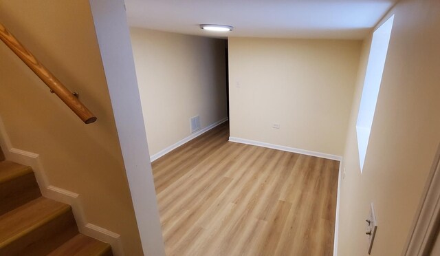 4627 W Schubert Ave, Chicago, IL 60639 - below grade area with baseboards, visible vents, stairway, and wood finished floors