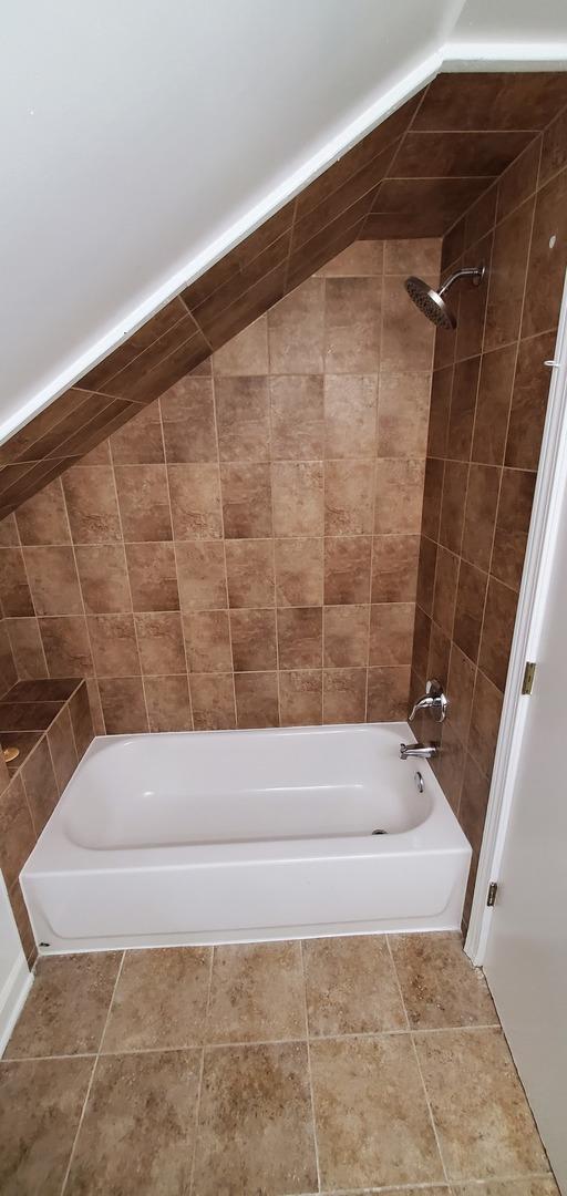 4627 W Schubert Ave, Chicago, IL 60639 - bathroom featuring shower / bathtub combination