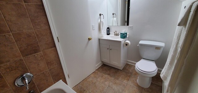4627 W Schubert Ave, Chicago, IL 60639 - bathroom featuring baseboards, toilet, and vanity