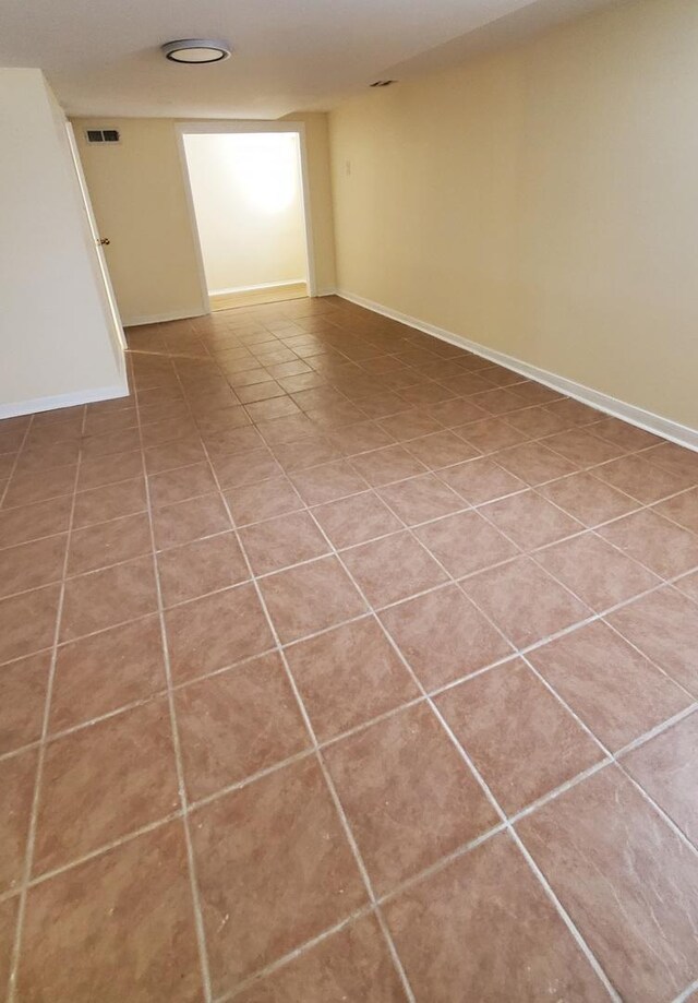 4627 W Schubert Ave, Chicago, IL 60639 - empty room with tile patterned floors, baseboards, and visible vents
