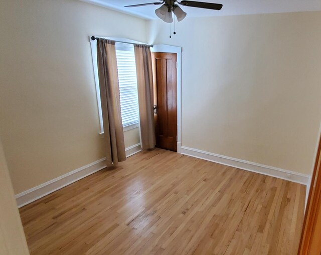 4627 W Schubert Ave, Chicago, IL 60639 - spare room with a ceiling fan, baseboards, and light wood-style flooring