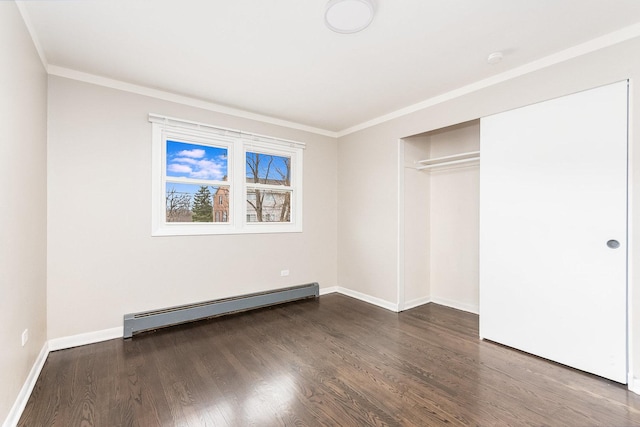 119 N Cliff St, Willow Springs, IL 60480 - unfurnished bedroom with baseboard heating, dark wood-style floors, crown molding, and a closet