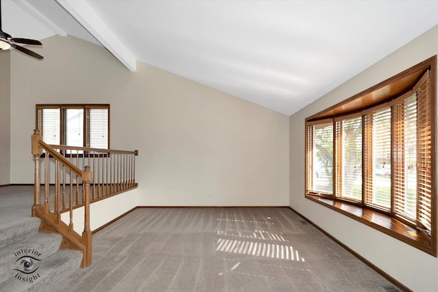 unfurnished living room featuring carpet floors, a healthy amount of sunlight, and vaulted ceiling with beams