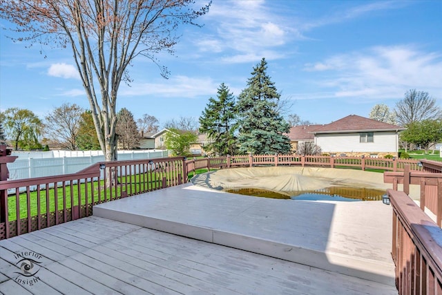 deck featuring fence and a lawn