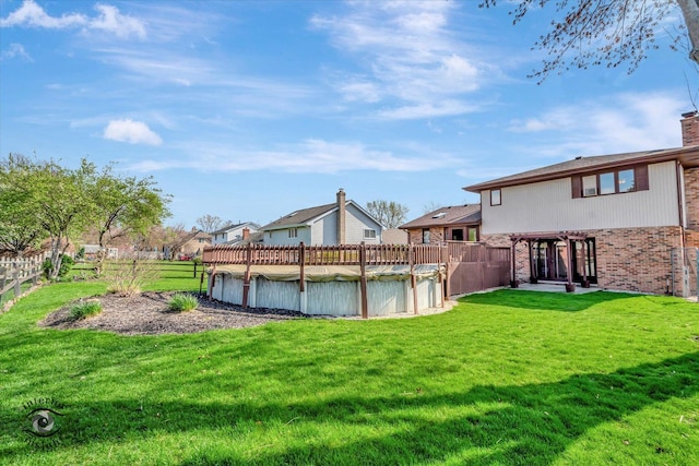 exterior space featuring a yard, fence, and a fenced in pool