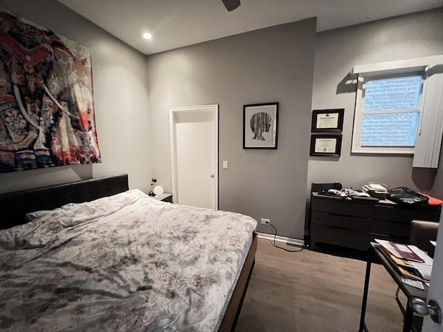 bedroom with a ceiling fan, recessed lighting, and wood finished floors