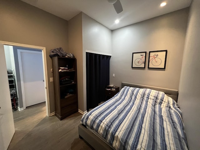 bedroom with a ceiling fan, recessed lighting, baseboards, and wood finished floors