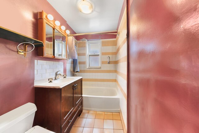 bathroom with tile patterned floors, shower / bath combo with shower curtain, backsplash, toilet, and vanity
