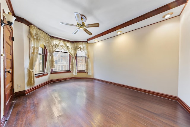 empty room featuring baseboards, ceiling fan, and dark wood-style flooring
