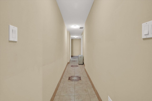 6510 S Woodlawn Ave Unit 1, Chicago, IL 60637 - hallway with light tile patterned floors, baseboards, and visible vents