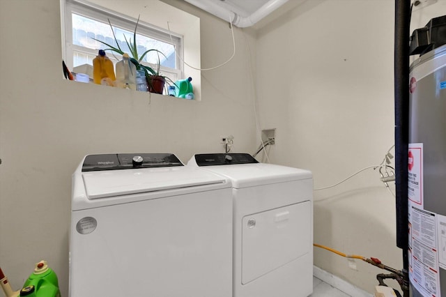 6510 S Woodlawn Ave Unit 1, Chicago, IL 60637 - laundry room featuring washing machine and clothes dryer, gas water heater, and laundry area
