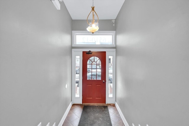 6510 S Woodlawn Ave Unit 1, Chicago, IL 60637 - tiled entrance foyer featuring baseboards