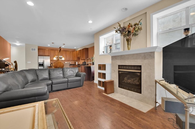 6510 S Woodlawn Ave Unit 1, Chicago, IL 60637 - living room with light wood finished floors, a fireplace, visible vents, and recessed lighting