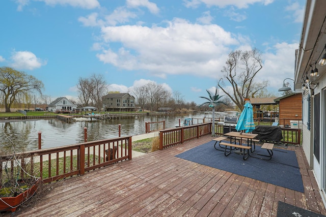 deck featuring a water view and a dock