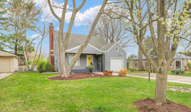 view of front of property with concrete driveway, a front lawn, roof with shingles, and a chimney