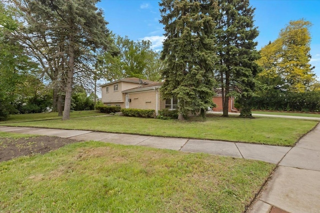 5323 Lee St, Skokie, IL 60077 - view of front of home featuring a front lawn and brick siding