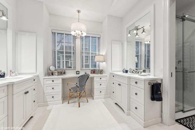 full bath with a shower stall and two vanities