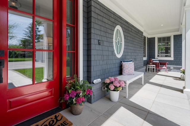 property entrance with covered porch