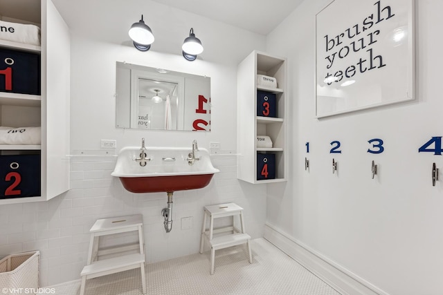 bathroom with a sink and tile patterned flooring