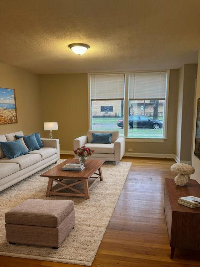 2057 Pine St, Des Plaines, IL 60018 - living area featuring a textured ceiling, baseboards, and wood finished floors