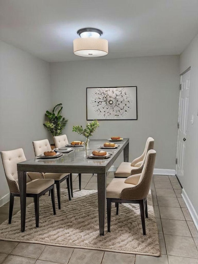 2057 Pine St, Des Plaines, IL 60018 - dining area with baseboards and light tile patterned floors